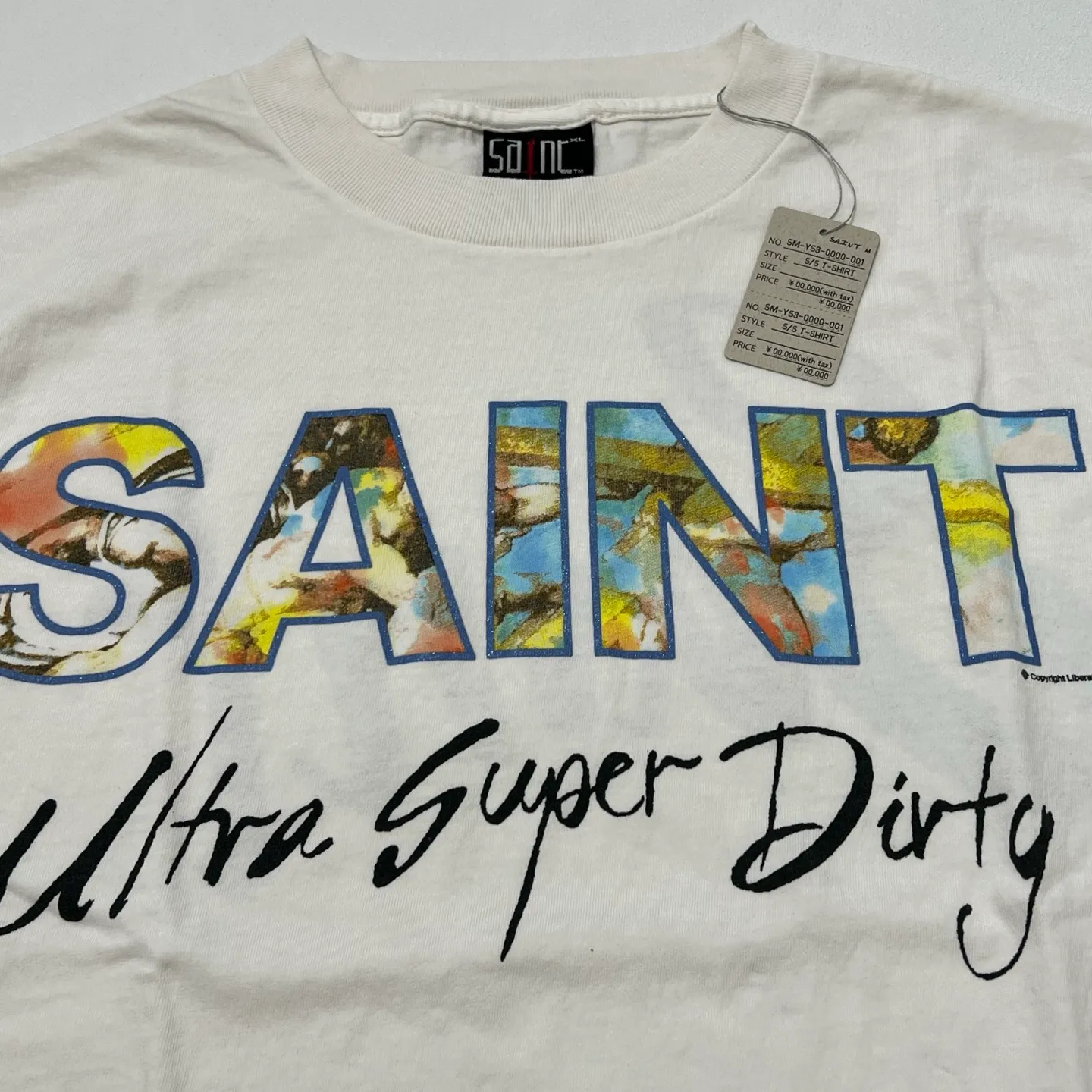 SAINT Mxxxxxx SS TEE/SUPER DIRTY/WHT oil painting SAINT SUPER DIRTY slogan TEE off-white S-XL Made of original OE yarn tube weaving without side seams to distinguish the split fabrics original consistent VINTAGE label/little angel anti-counterfeiting label top printing technology highly restored original details